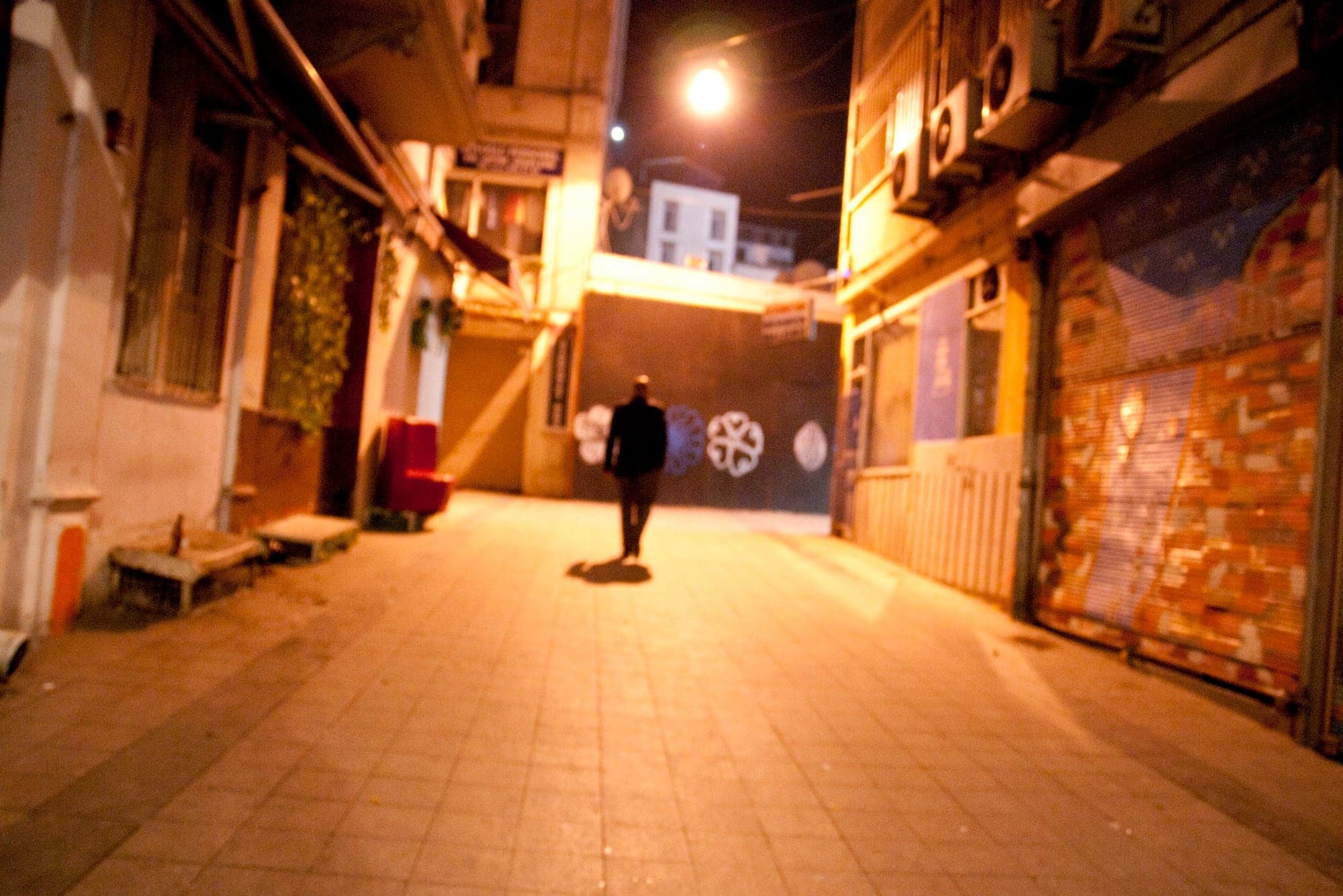 A warm-lit alley at night