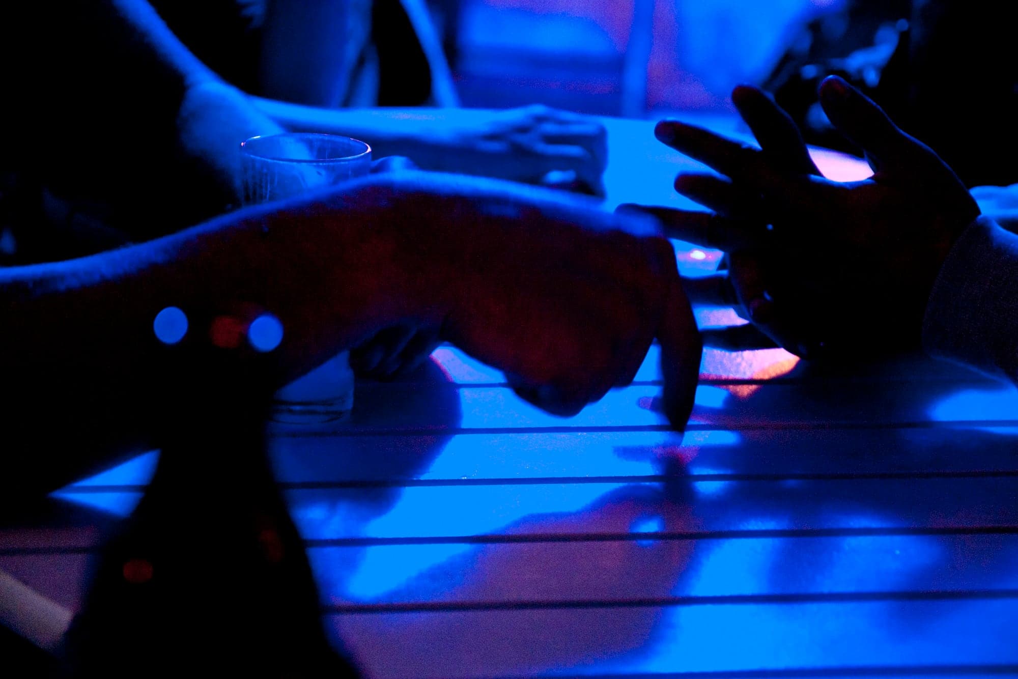 Hands under blue light